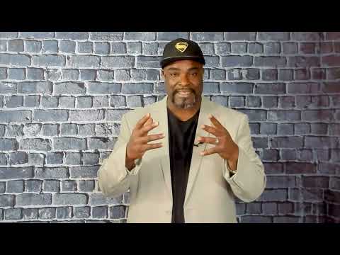 Atiba de Souza speaks in his OnlineJobs.ph video, wearing a Superman cap and a light jacket.