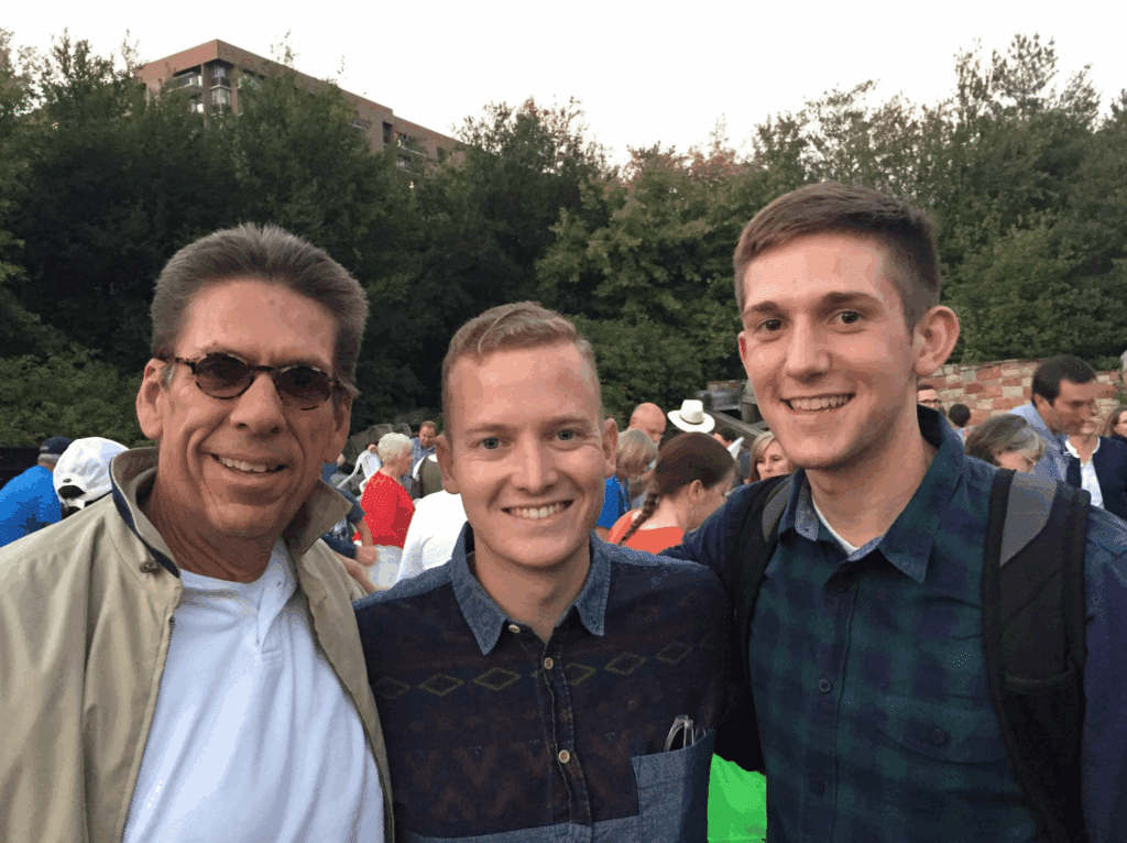Photo from 2015 of John Haynes with two young men at an outdoor event in Salt Lake City