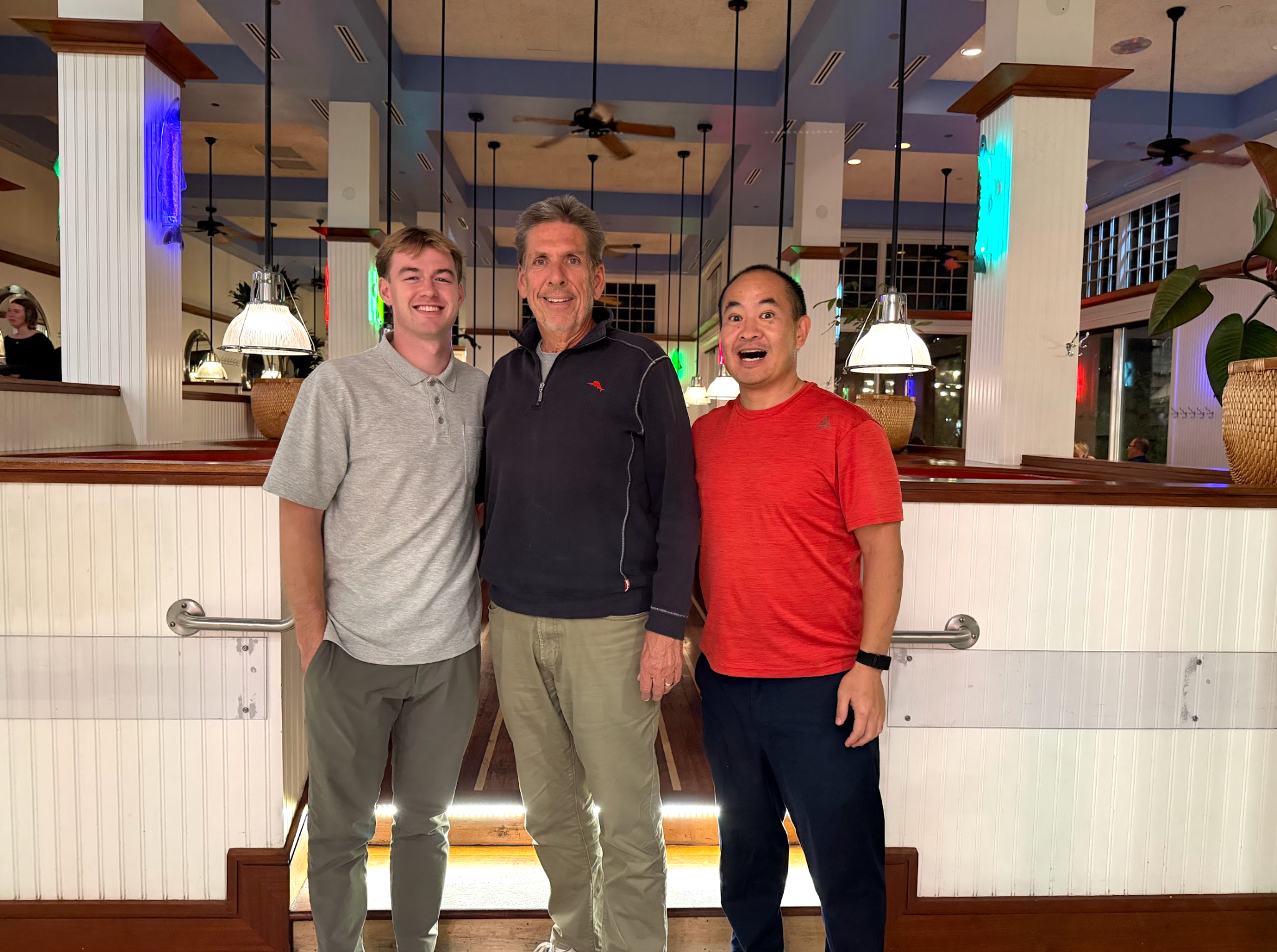 Group photo of Sam McLeod, John Haynes, and Dennis Yu at dinner in Salt Lake City, October 2025