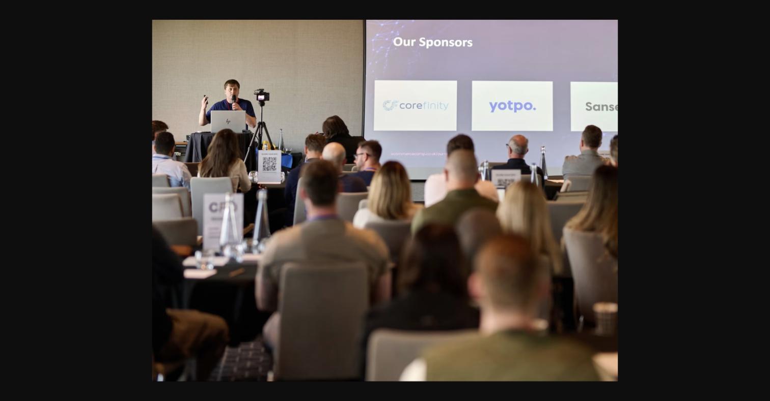 Paul Ryazanov, CEO of MageCloud, speaking at an eCommerce conference