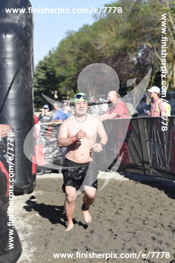 How I Finished an Ironman 70.3 on Zero Training (and a Facebook Marketplace Bike) 3 Dennis Yu running the Ironman 70.3 half marathon roughly 70 pounds overweight