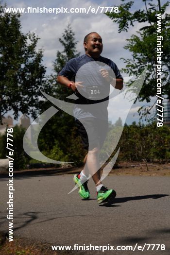 How I Finished an Ironman 70.3 on Zero Training (and a Facebook Marketplace Bike) 4 Dennis Yu on the run course at Ironman 70.3 Coeur d'Alene