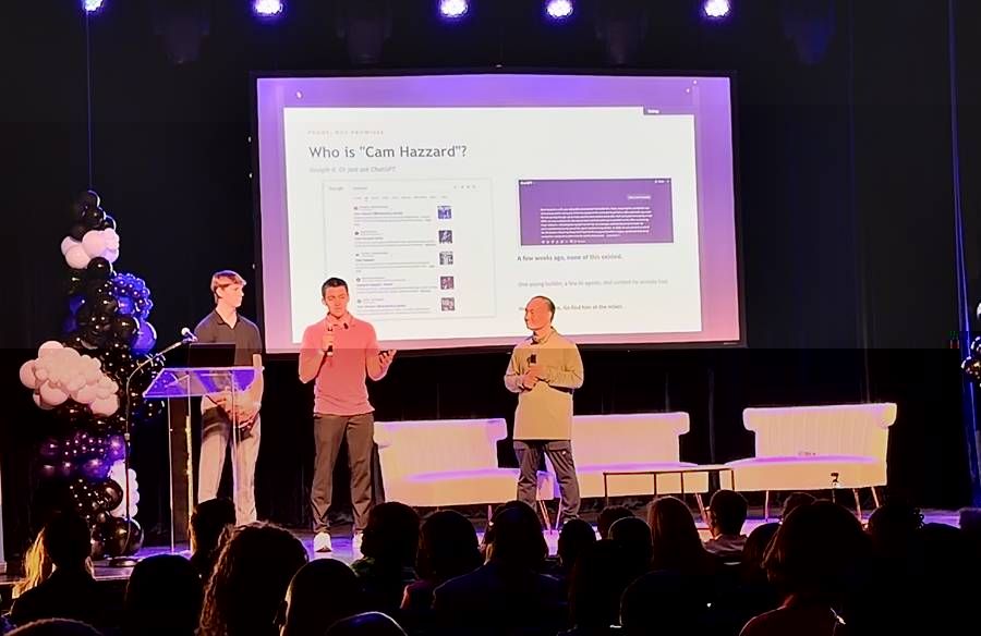 Dennis Yu on stage with Cam Hazzard and Dylan Haugen at the DSDT AI Summit in Detroit