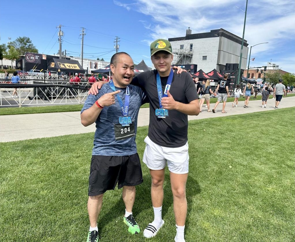Dennis Yu and Marko Sipila with their finisher medals at Ironman 70.3 Coeur d Alene 2024