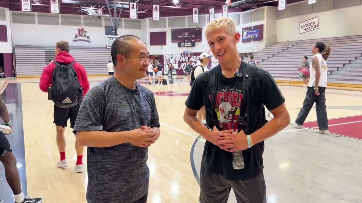Dennis Yu interviewing Nathaniel "Hoopin Nate" Kenney courtside at Dunk Camp