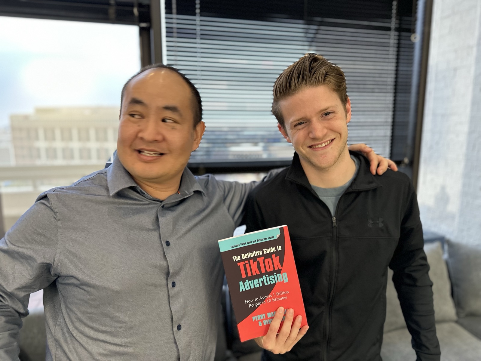 Two men posing with The Definitive Guide to TikTok Advertising