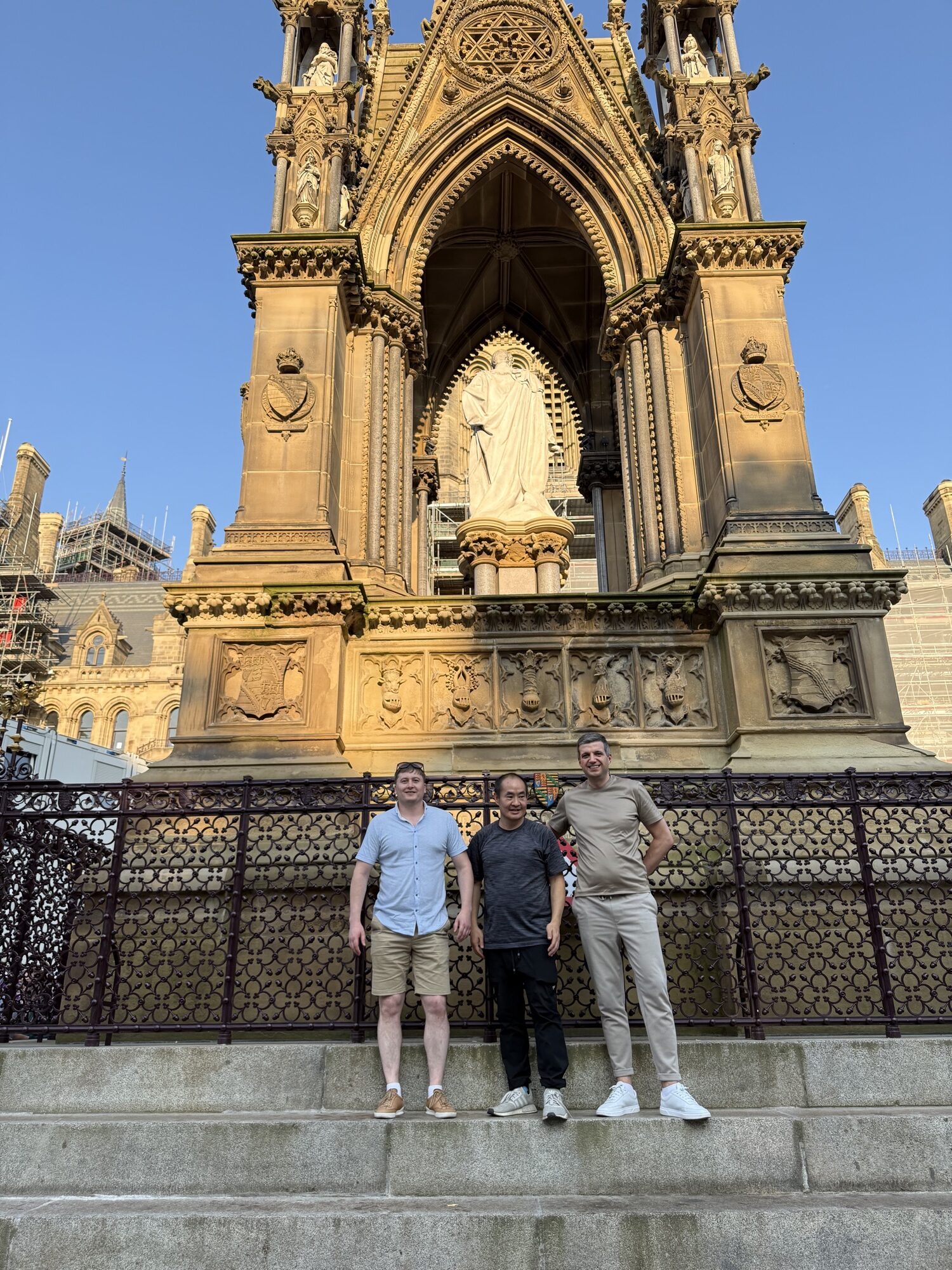 Paul Ryazanov, Dennis Yu, and a colleague at the Albert Memorial, Manchester, July 2026
