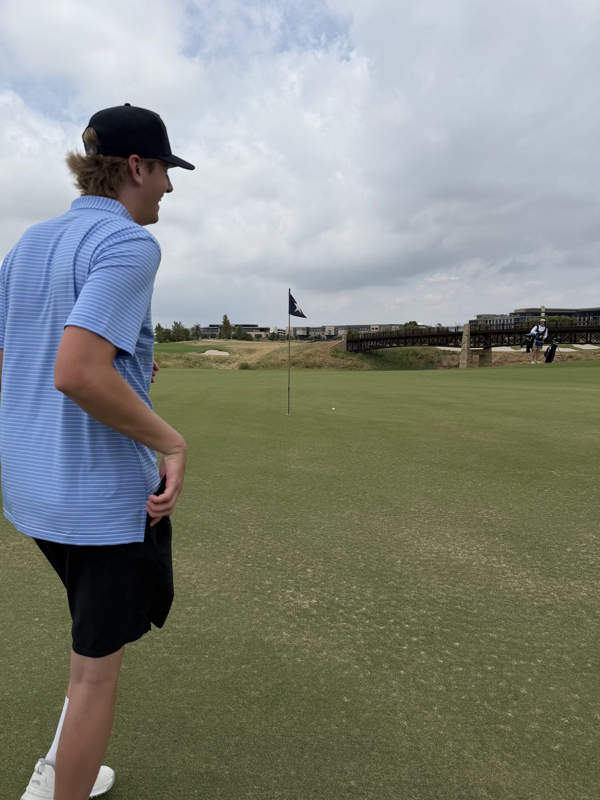Aden Trano mid-swing on the course at the Sphere Rocket Open