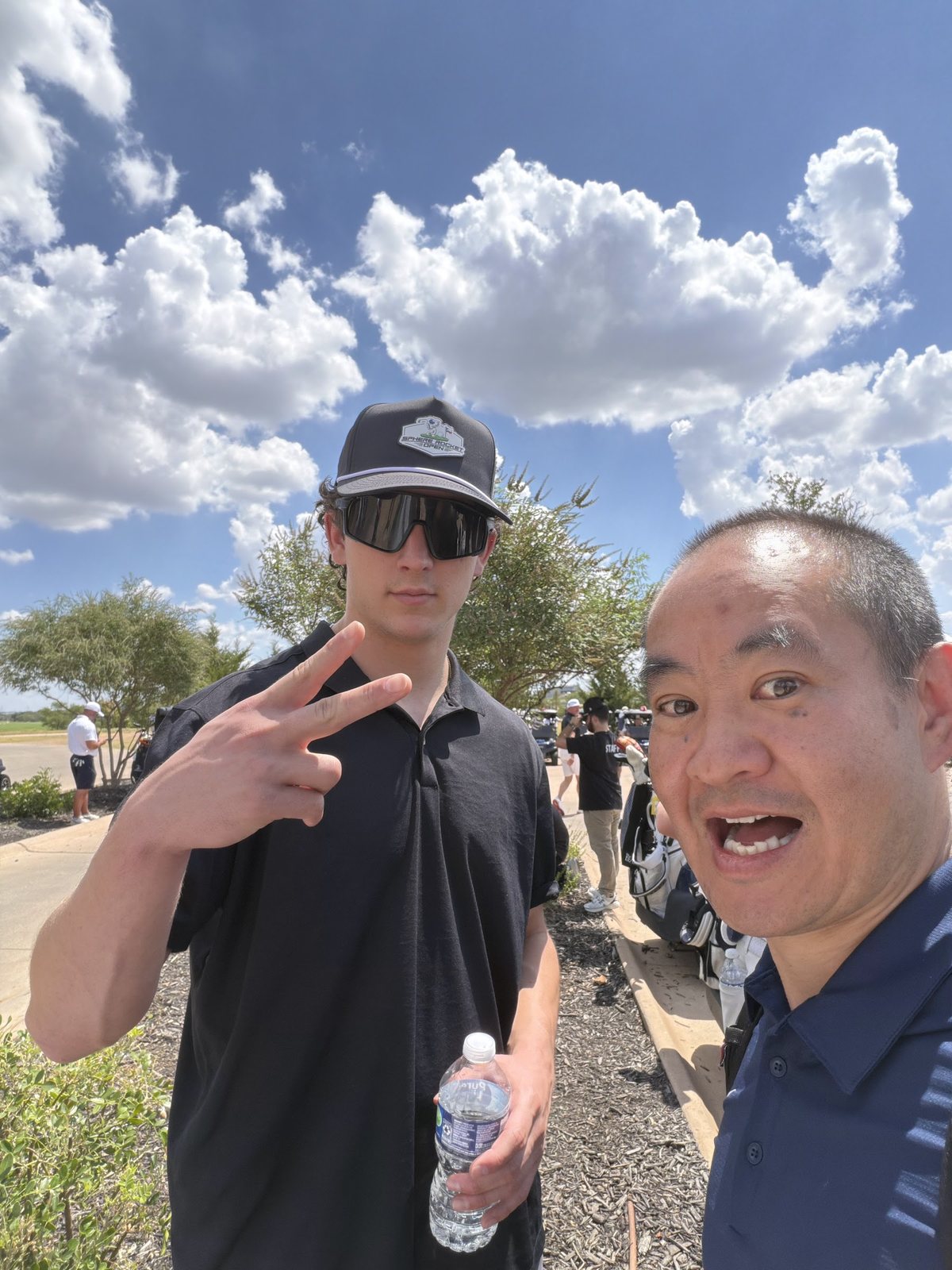 Dennis Yu and Jack Allard on the course under a big Texas sky