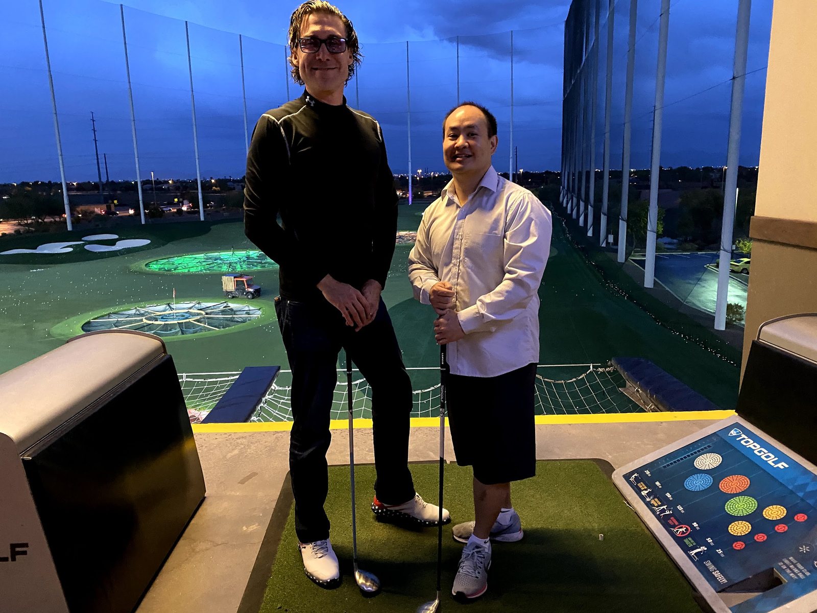 Dennis Yu with a friend at Topgolf, December 2019