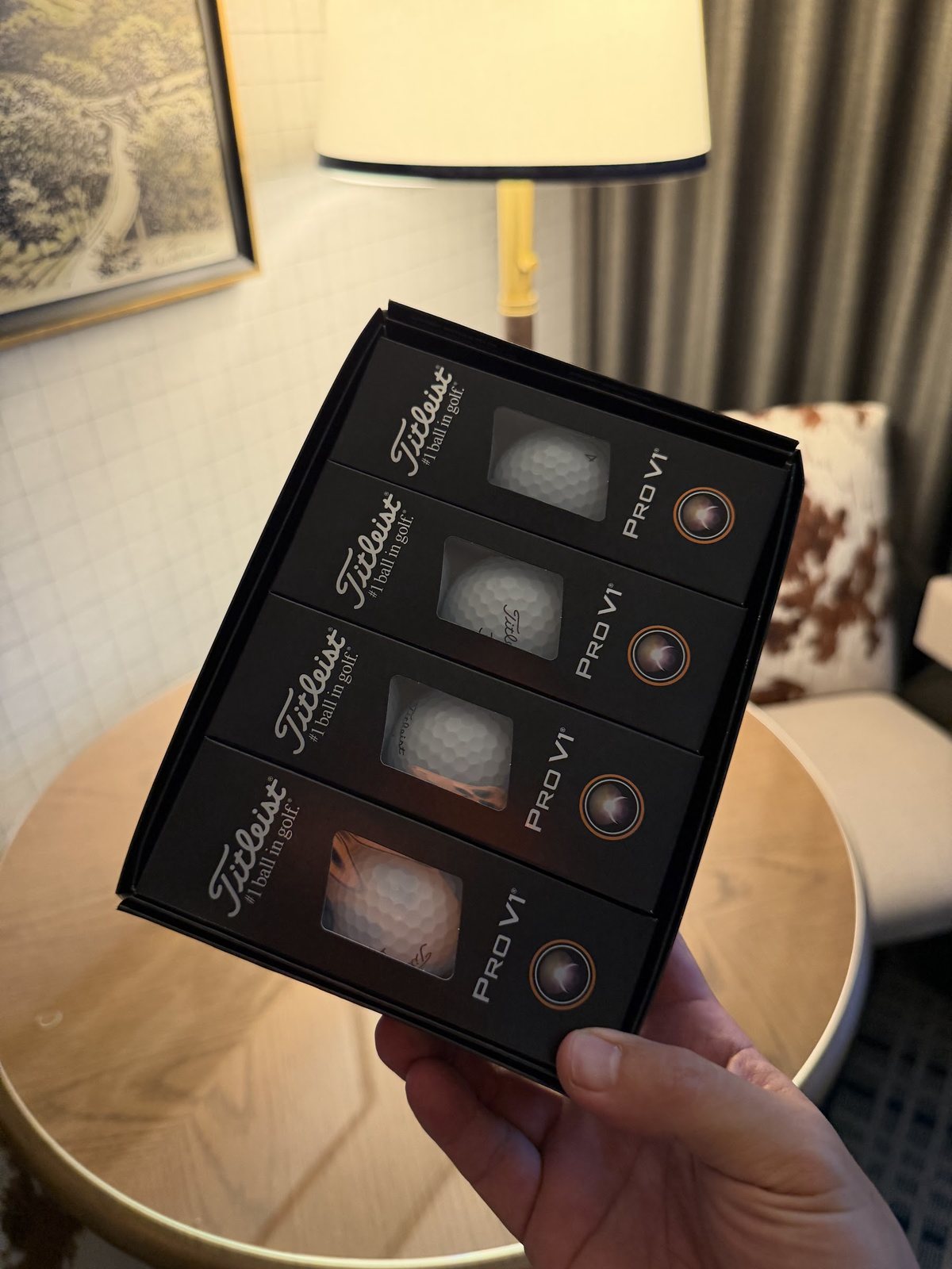 A box of Titleist Pro V1 golf balls, the welcome gift in the hotel room