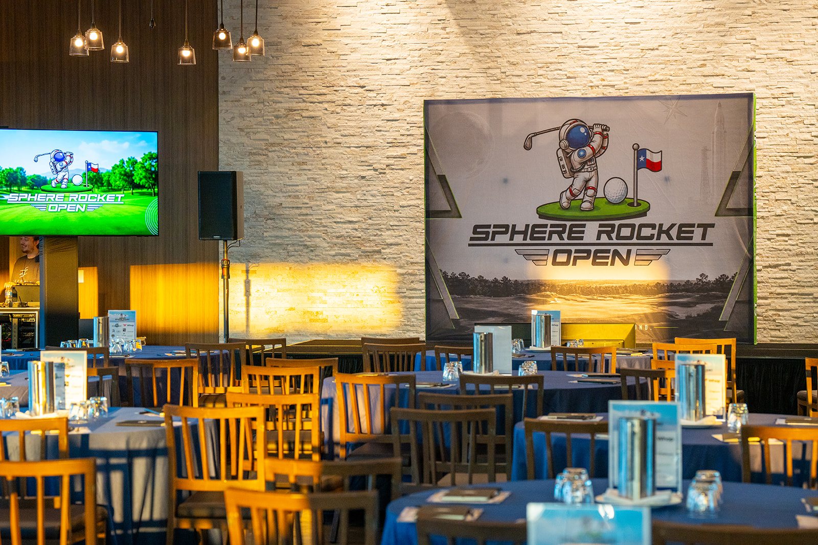 The Sphere Rocket Open stage and astronaut-golfer backdrop before sessions began